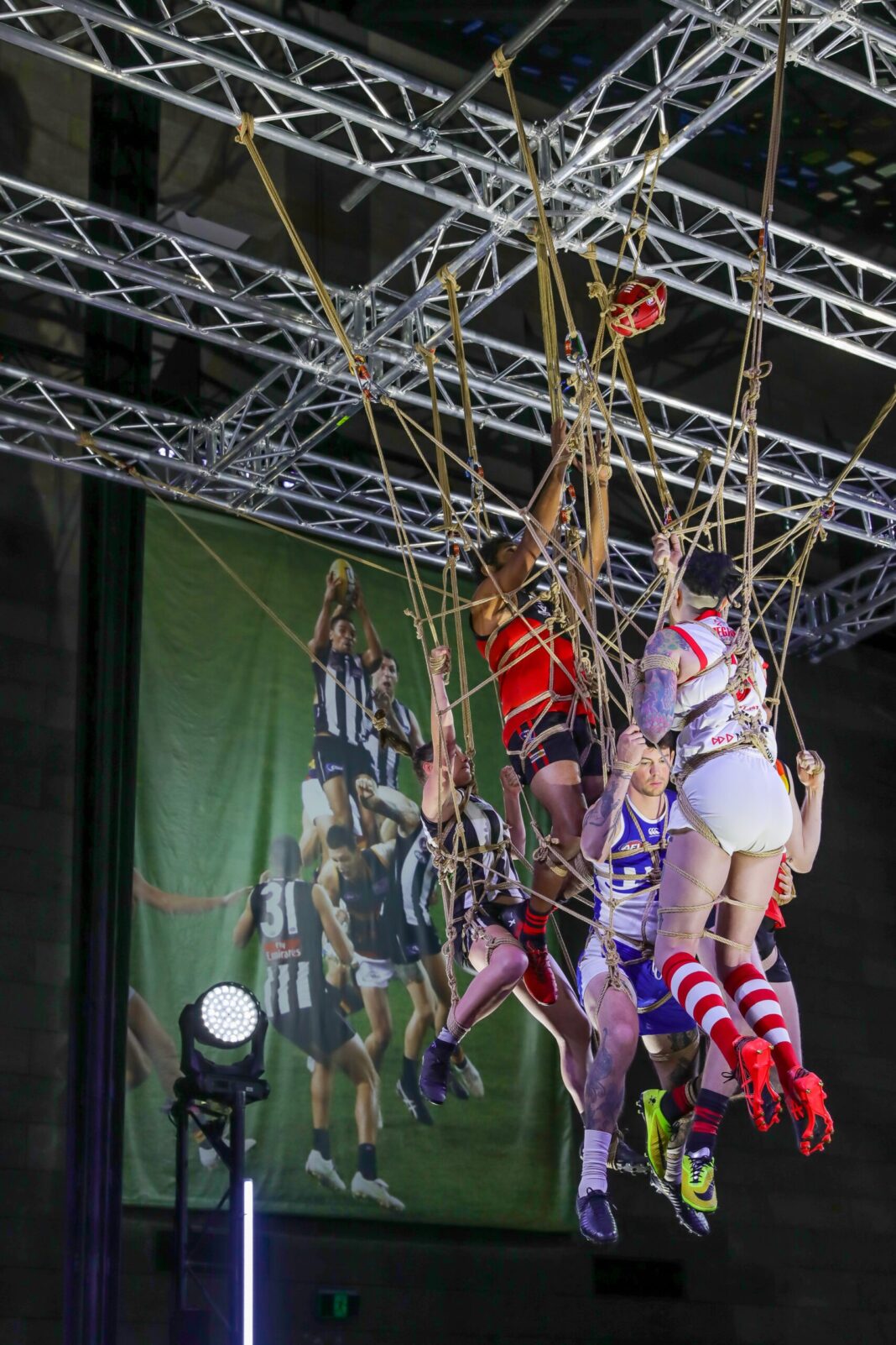 afl stars strung up in rope at the ngv